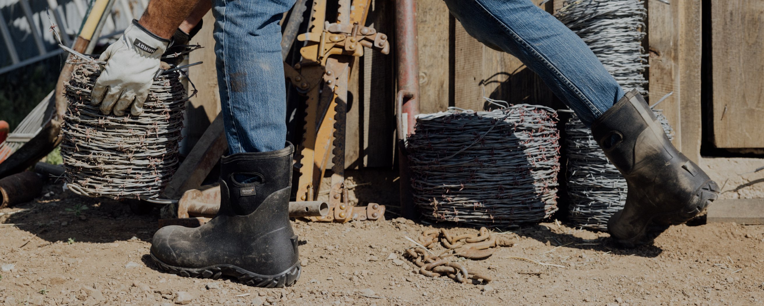 Image features the men's Workman Mid outside a workshop.