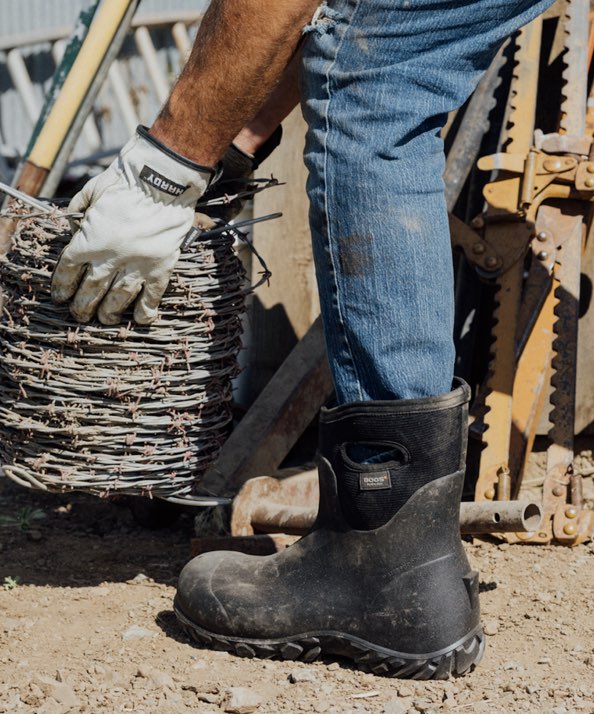 Image features the men's Workman Mid outside a workshop.