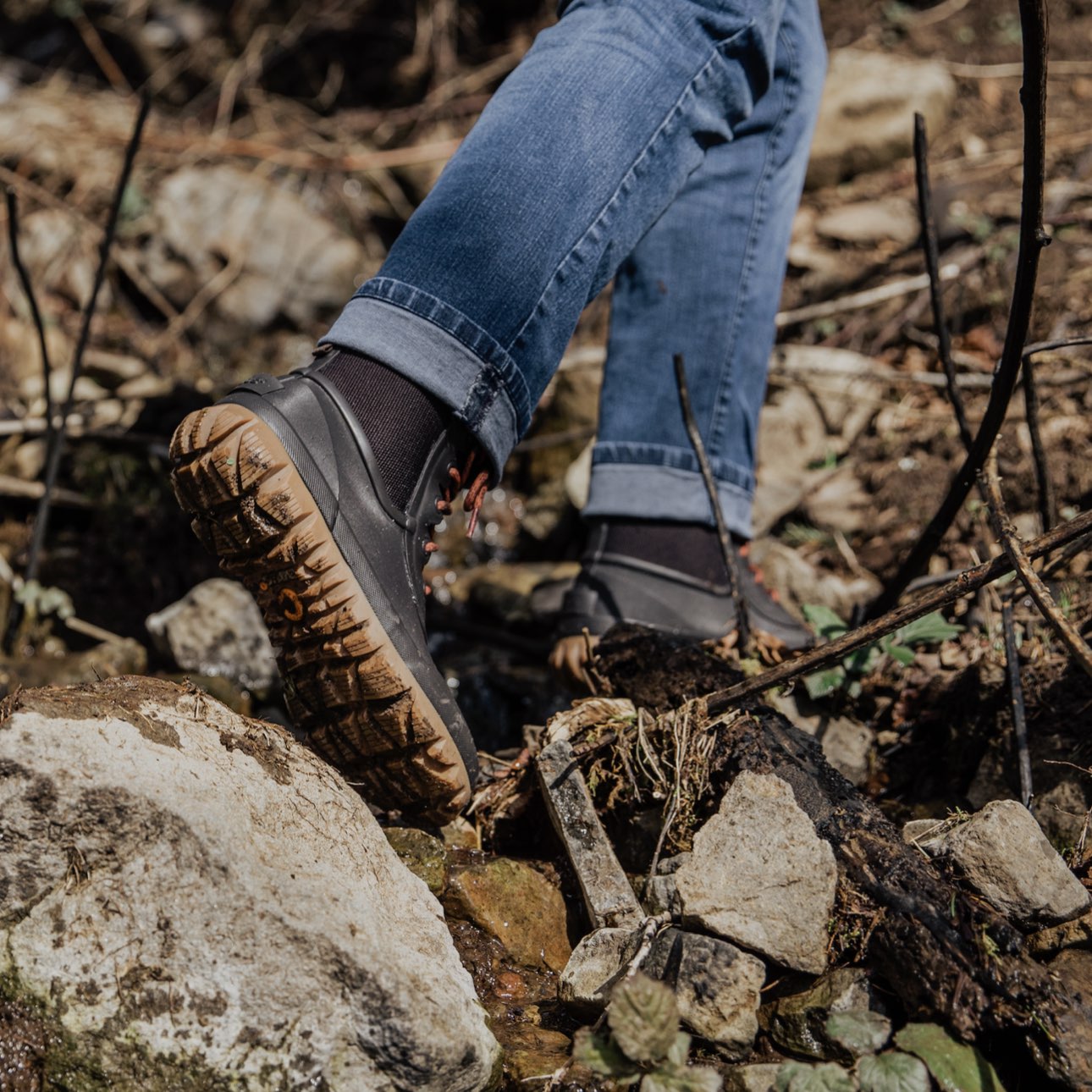 Image features the men's Arcata Urban lace up boot in the woods.