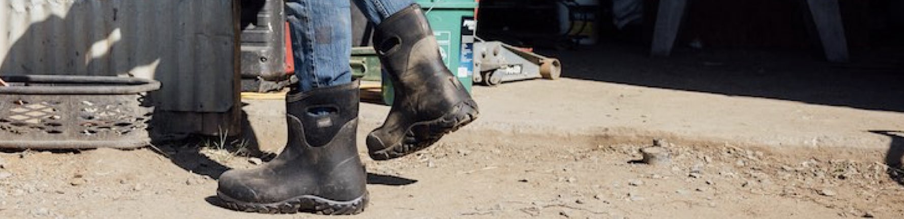 Click to shop men's Workman boots. Image features the Workman Mid in front of a workshop.