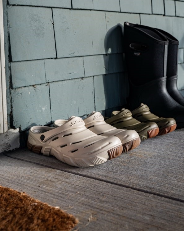 Shop our Men's & Women's Boga casual slip on boots. The image shown is our oatmeal and green colorways on a house porch