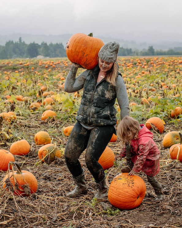 The image shown is a mom and wife in a muddy pumpkin patch. Fall is officially here, get your pumpkin & shop our kids boots.