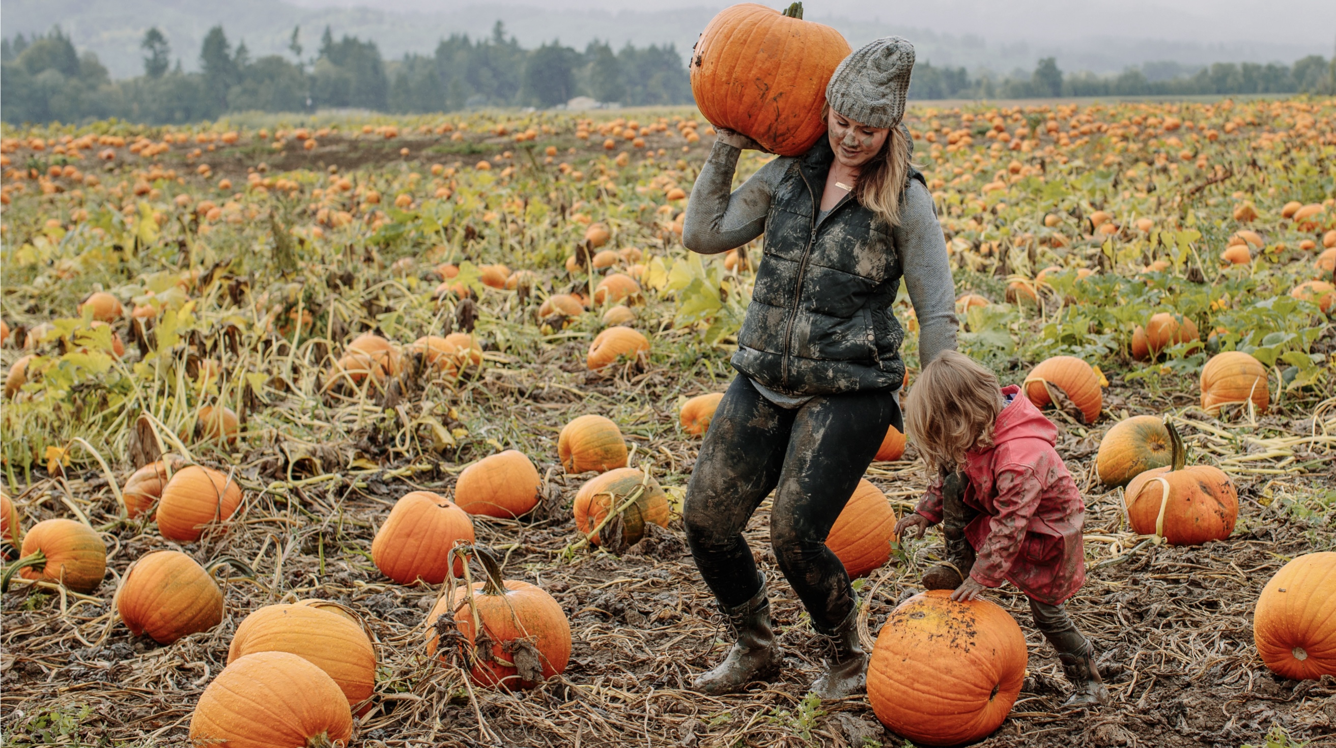 The image shown is a mom and wife in a muddy pumpkin patch. Fall is officially here, get your pumpkin & shop our kids boots.